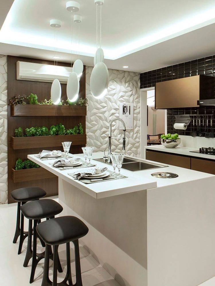 Horta-Em-Apartamento-10 Cozinha com ilha branca, parede marrom com prateleiras com hortas